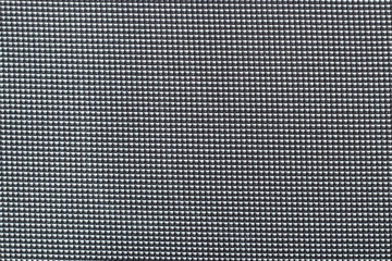 Closeup black or dark grey colors fabric sample texture high contrast.