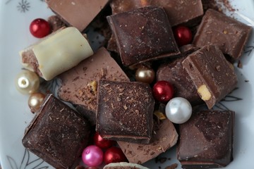 cocoa and milky chocolates on the blue floor