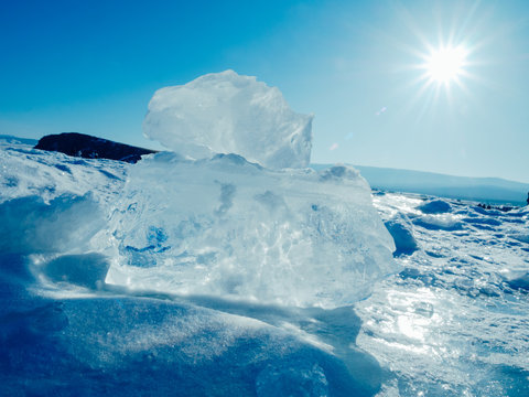 Blocks of ice gleaming in the sun. Arctic winter background.