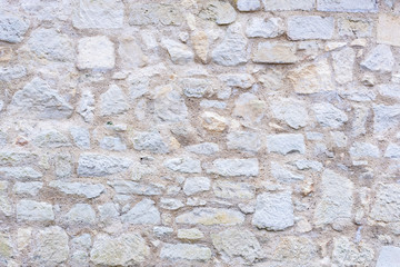 Eine alte Steinmauer mit schöner Struktur als Hintergrund