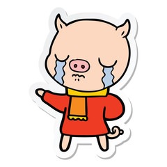 sticker of a cartoon crying pig wearing scarf