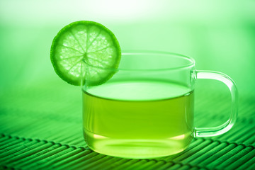 A cup of green tea with mint