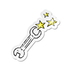 retro distressed sticker of a cartoon spanner