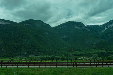 Fototapeta na wymiar Italy,La Spezia to Kasltelruth train, a wooden bench in front of a mountain
