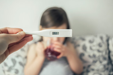  Thermometer close up. The thermometer shows a temperature of 36.6. Baby got better