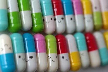 Happy smiley made of drugs on blue background (life style) 