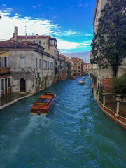Boats in canal Venice Italy