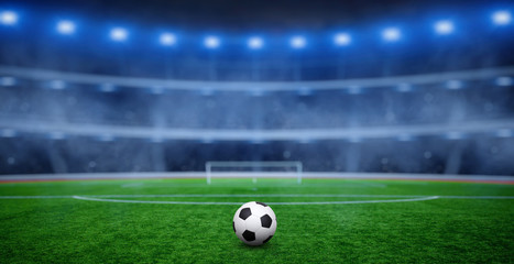 Ball on gras in soccer stadium