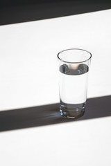 glass of water minimalism style, shadows and lights elegant rhythm vertical picture