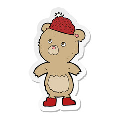 sticker of a cartoon bear in hat
