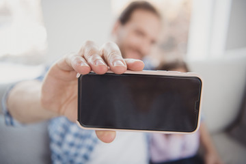 Close-up portrait of cell camera pre-teen girl handsome dad taking making selfie photo daydream fashion style blog blogger in light white interior room indoors