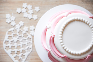 Making and decorating wedding cake with elements from pastry mastic. Top view. Cooking ingredients. Mockup for menu, recipe or culinary classes.