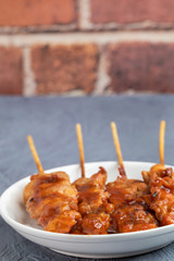 Thai style barbecue grilled chicken and stick on plate