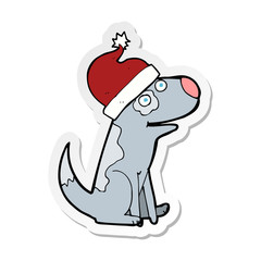 sticker of a cartoon dog wearing christmas hat