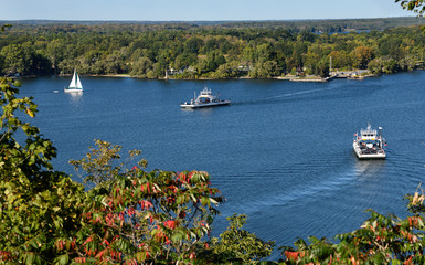 Free Glenora car Ferries to Adolphustown on blue Adolphus Reach with white sailboat on Bay of...