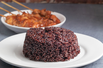 close up of steamed riceberry rice on plate
