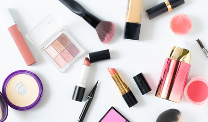 Set of decorative cosmetics blush,powder,mascara and lipstick on white background.