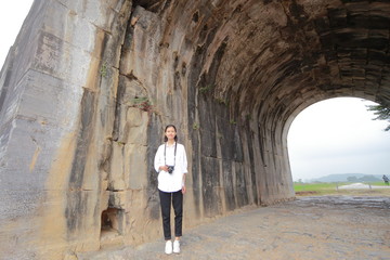 Fototapeta na wymiar woman traveling to Ho citadel in Thanh Hoa,Vietnam