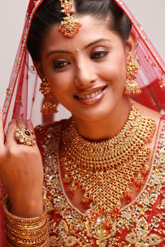 Indian bride in traditional bridal sari in studio lighting indoor