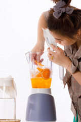 girl is learning to make fruit juicc