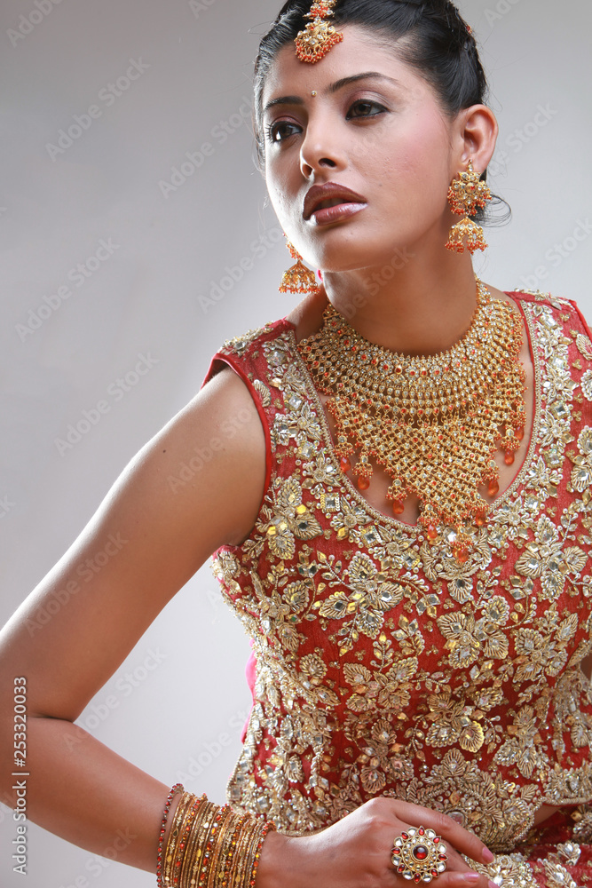 Wall mural indian bride in traditional bridal sari in studio lighting indoor