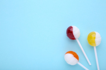 Lollipops on blue background. sweet candy concept
