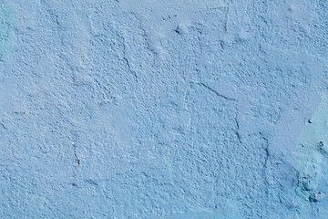 Fototapeta na wymiar closeup of chipped paint on blue wall , texture ready