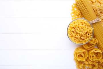 Delicious mixed pasta on white background with copy space