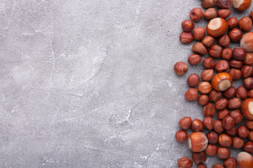 Delicious hazelnut on a grey concrete background