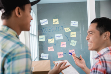 young man workers dialogue gesture about got a some ideas to increase the office target sale in the...