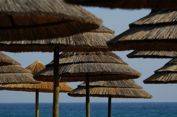  straw parasols on a paradisiacal beach