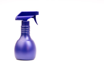 Purple blank plastic spray detergent bottle isolated on white background. Selective focus