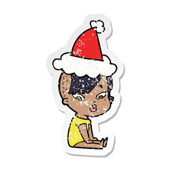 distressed sticker cartoon of a surprised girl wearing santa hat