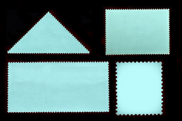 Set of old blue grunge postage stamps reverse side of different geometric shapes isolated on black background