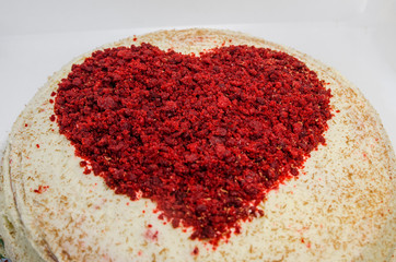 Red velvet cake with a heart on top of it 