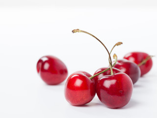 ripe cherries isolated on white