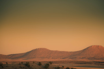 Fototapeta na wymiar The high, open desert of Arizona with mountains in the distance.