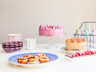 party setting on table cakes and pastery 