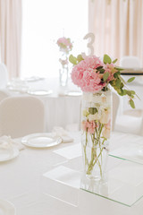 Tables set for an event party or wedding reception. luxury elegant table setting dinner in a restaurant. glasses and dishes.