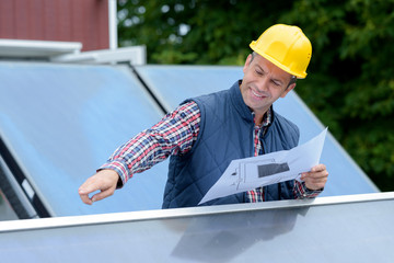 man is busy with solar panels