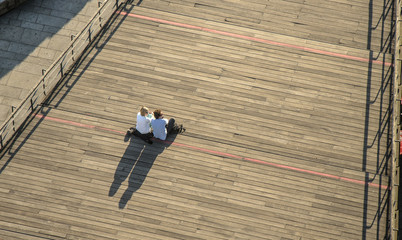Naklejka premium Enjoying view on city's ladders