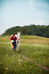 Medieval Princess with a White Horse in a Meadow - Room for Text