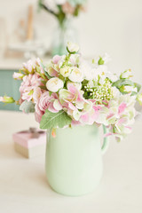 bouquet of flowers in a vase on the table in the kitchen