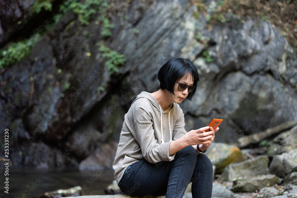 Poster Asian woman using mobile phone