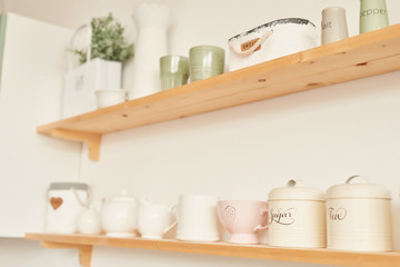 bright kitchen in the style of Provence, on the table dishes and a bouquet of flowers in a vase