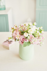 bouquet of flowers in a vase on the table in the kitchen