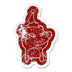 cute cartoon distressed sticker of a bear wearing santa hat