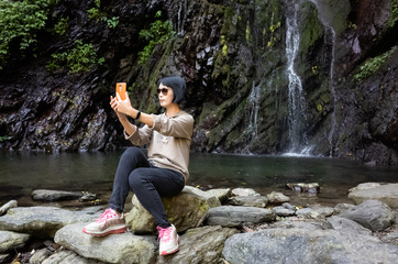 woman selfie near the waterfall