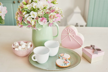 Gingerbreads for March 8 in the bright kitchen with flowers