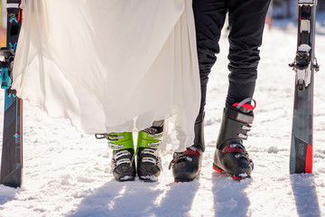 winter wedding bride and groom skiing 